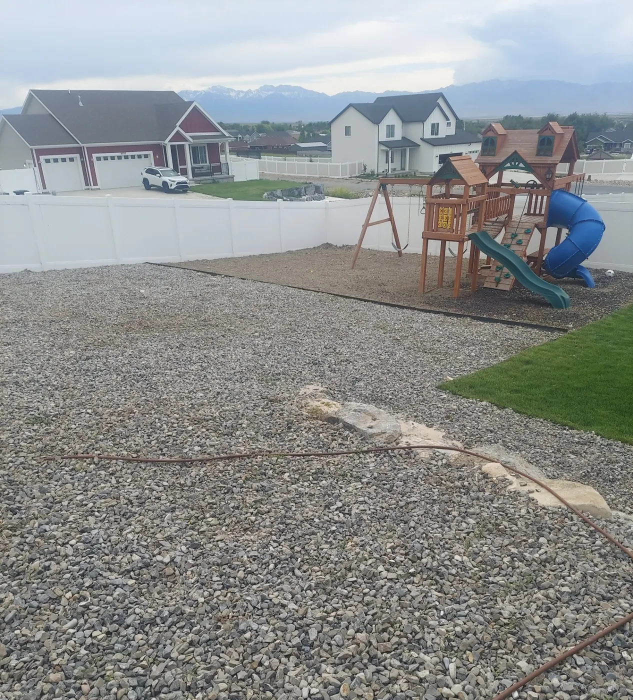 After: Weedy rock yard cleaned up