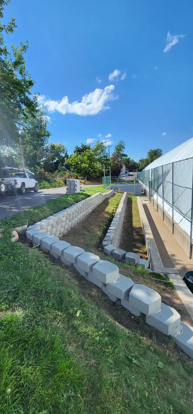 After: Slope to terraced retaining walls